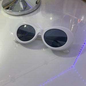 Funky white “clout” glasses